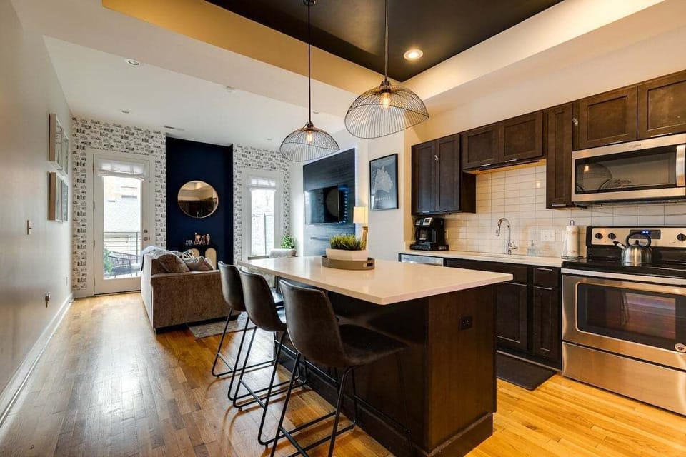 Fully applianced kitchen with island and breakfast with seating