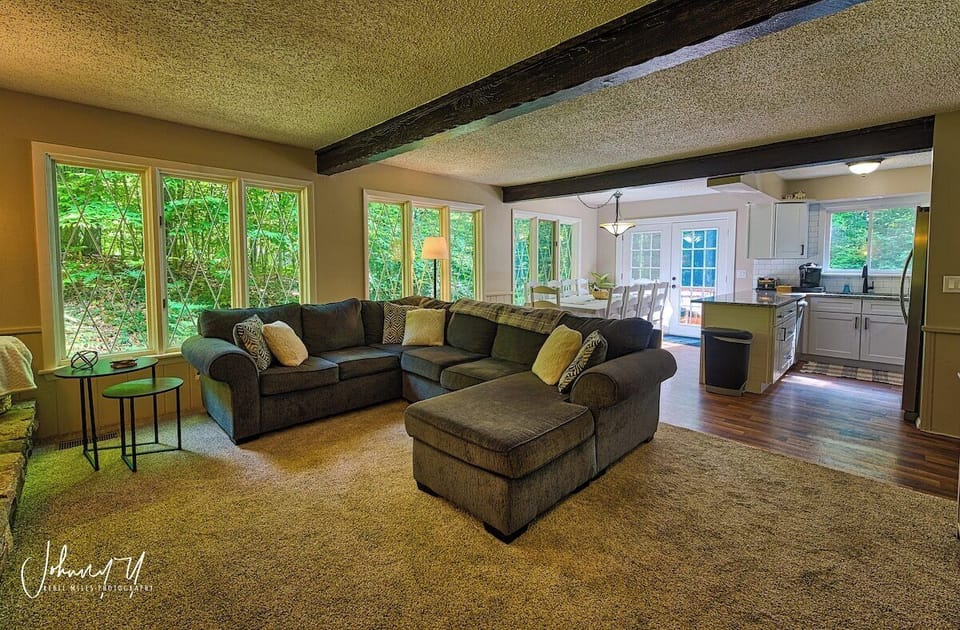 Enjoy a comfy fire under the original rustic beams for the home, due to the open concept anyone preparing a meal or cleaning can still be involved in all of the activities in the main living area