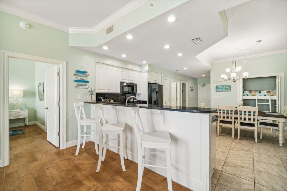 Sleek kitchen island w/ bar seating — a great spot for casual meals or morning coffee.