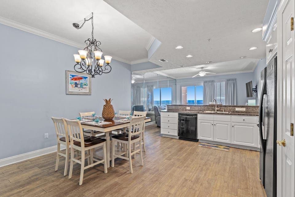 Open kitchen and dining area with ocean views and modern finishes