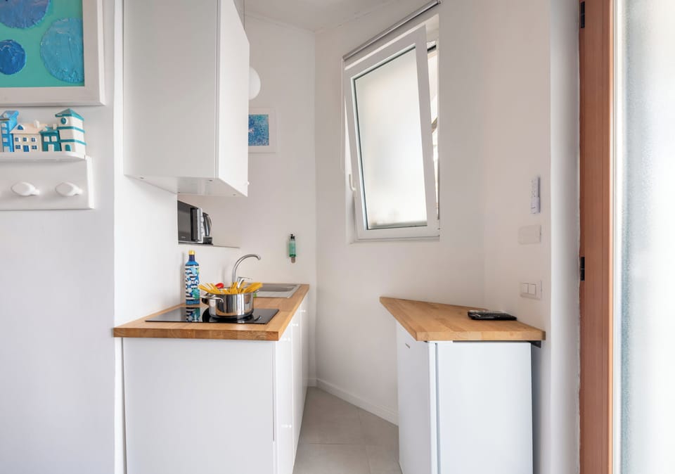 Family Apartment, Sea View, Split Level | Private kitchen | Coffee/tea maker, electric kettle, highchair, coffee grinder
