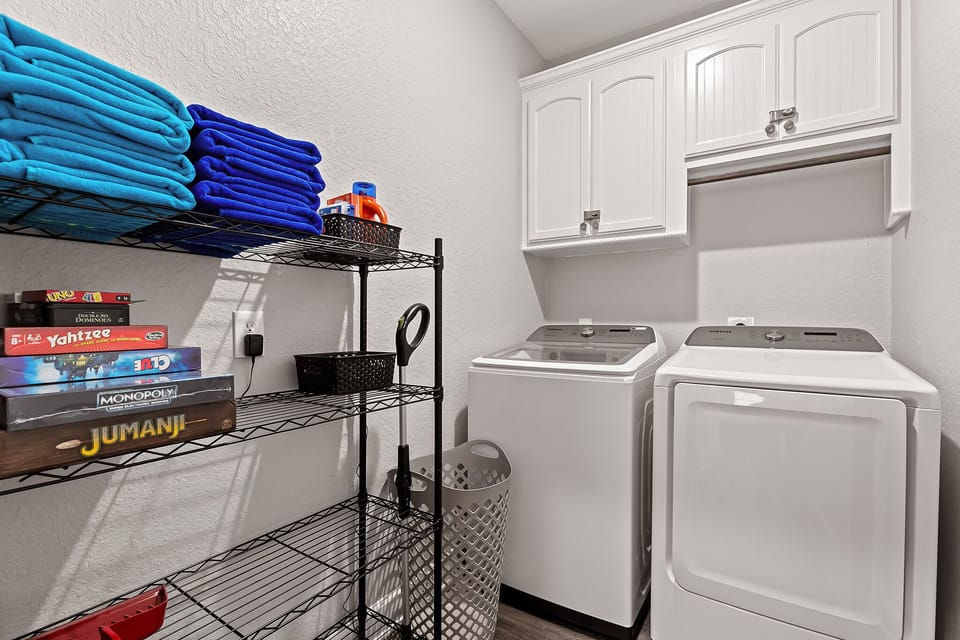 Laundry room w/ full size washer and dryer