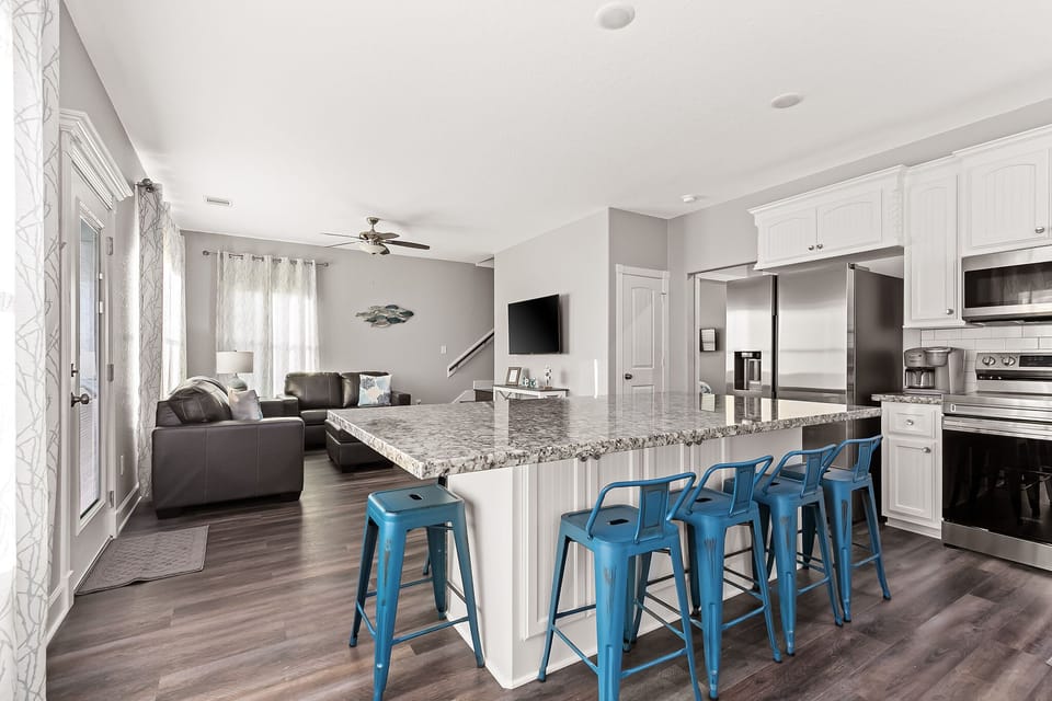 Large granite custom kitchen island. This is a must for playing cards and games!
