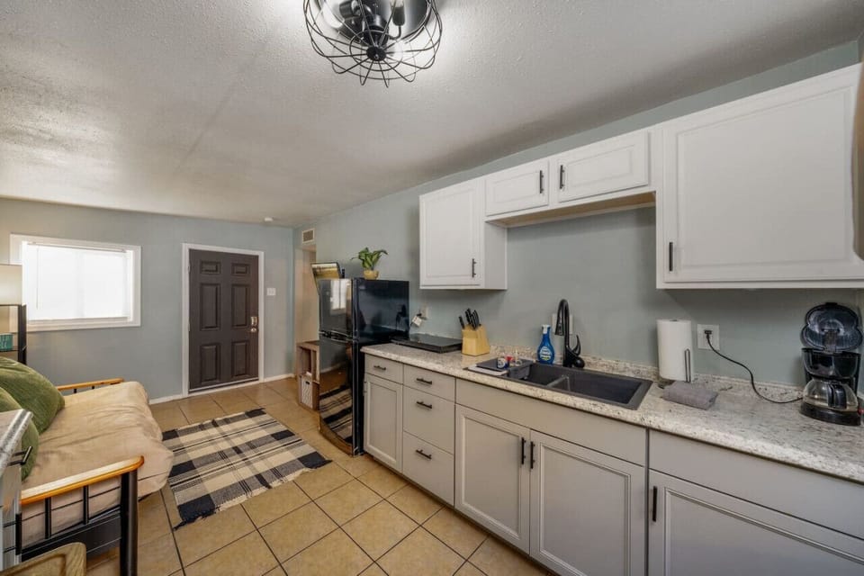 View of kitchenette facing the front door (futon for additional sleeping space, if needed)