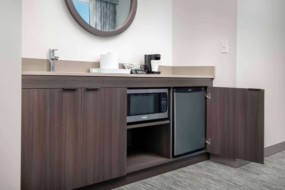 Desk, laptop workspace, blackout drapes, iron/ironing board