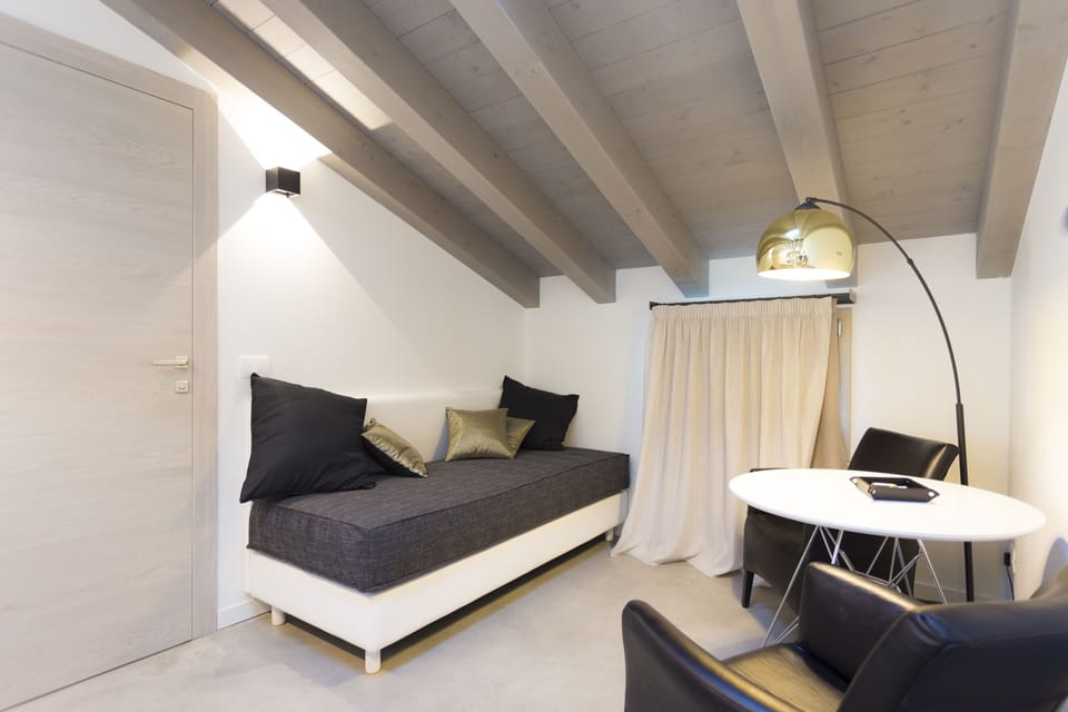 Luxury Studio Suite | Living area | 43-inch Smart TV with satellite channels, TV