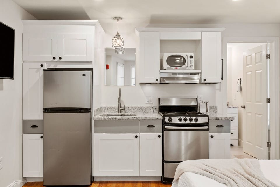 Kitchen with essentials. Glassware, utensils, baking sheets, cutting boards, and more. (1)