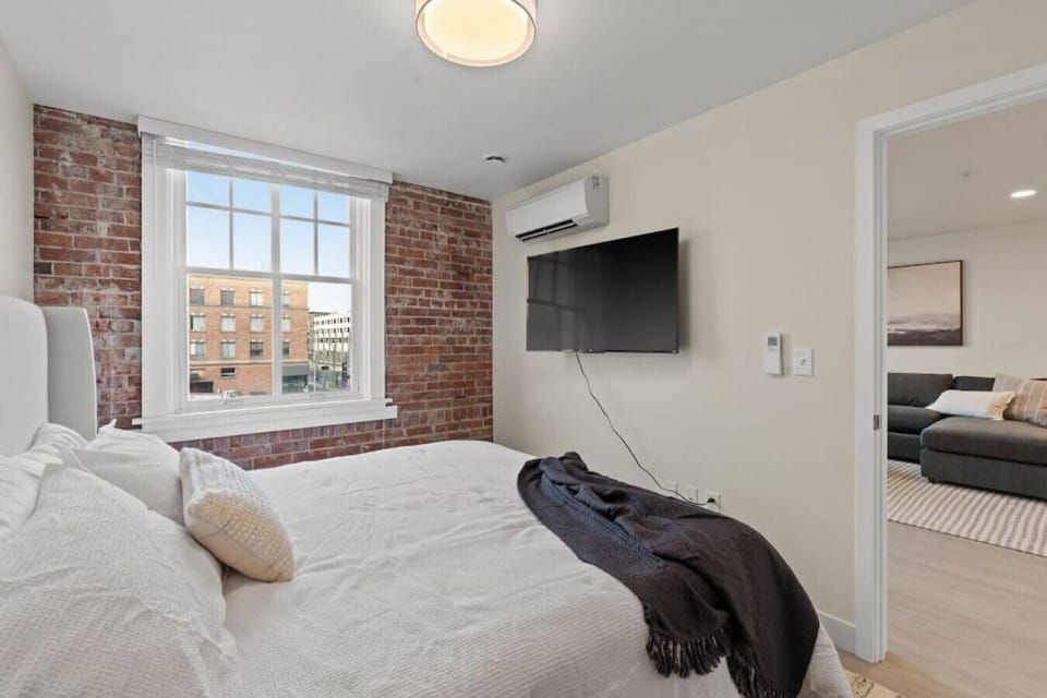 Soft linens and timeless design for a boutique-hotel feel.