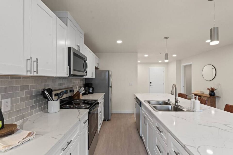 Bright, airy kitchen with plenty of counter space.
