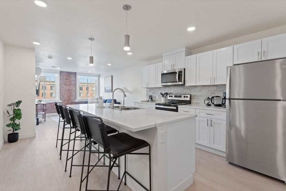 Open-concept design with quartz countertops and hand-picked finishes.