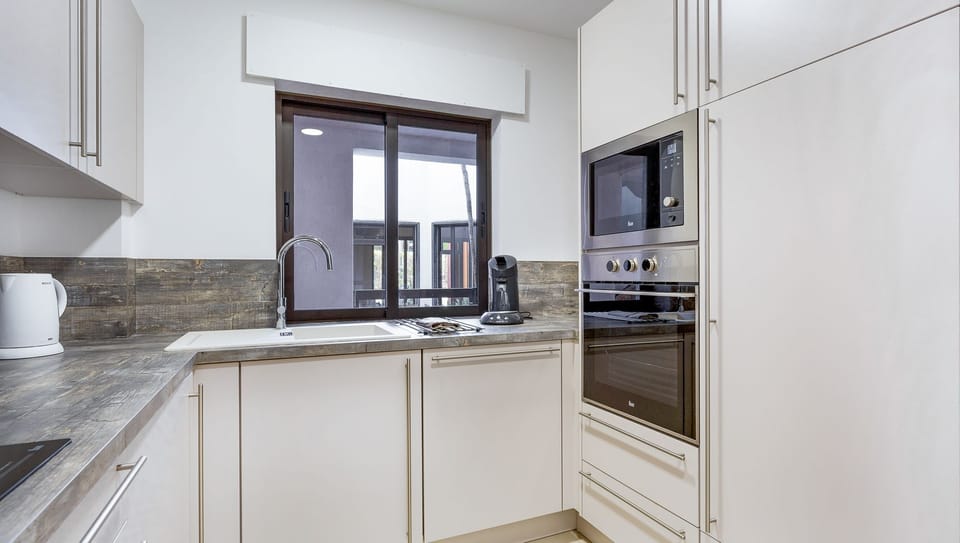 Our kitchen counts with an oven, stove, microwave, a coffee machine and a dishwasher #stunning #bright
