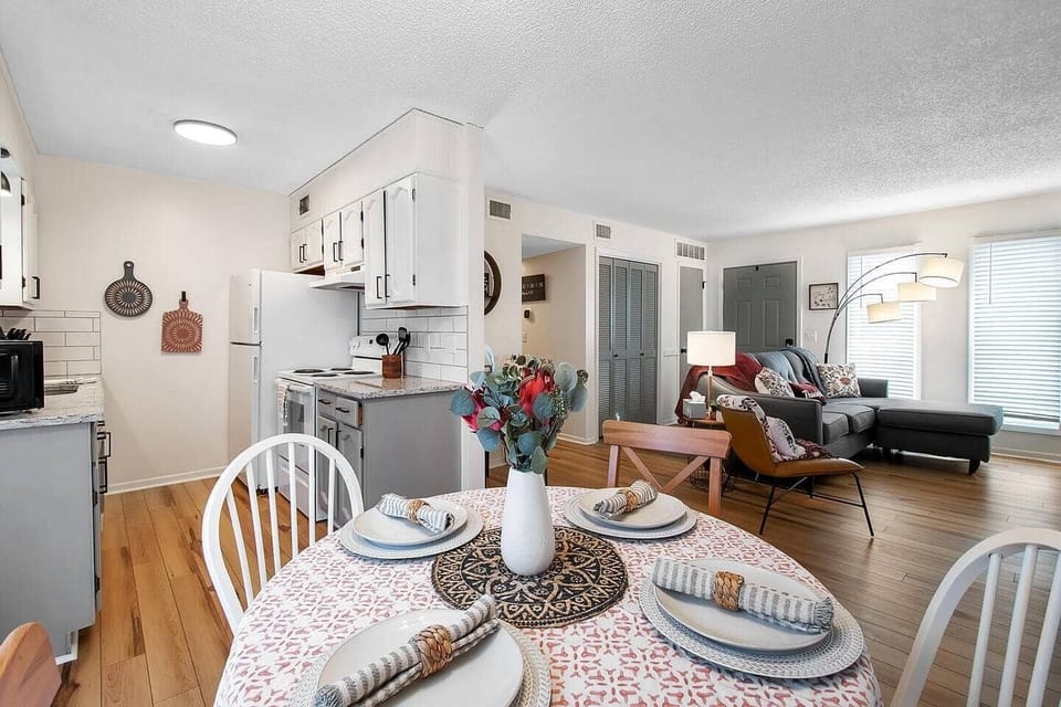 Open Living Room with Workspace, Dining Room, Coffee Bar.