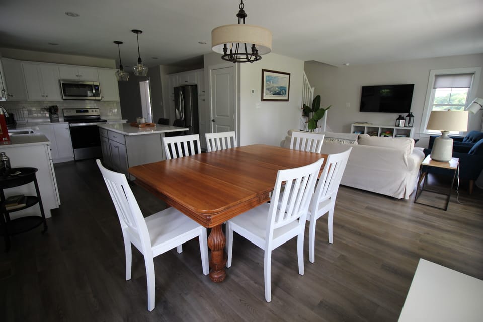Large table with two additional leaves and more chairs if needed