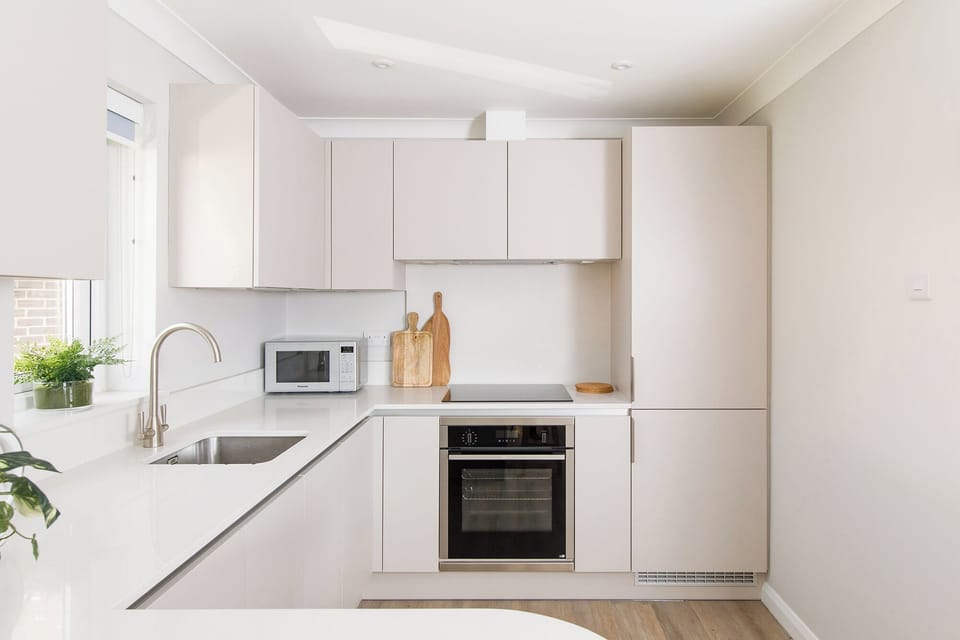 Fully equipped kitchen with storage and appliances 