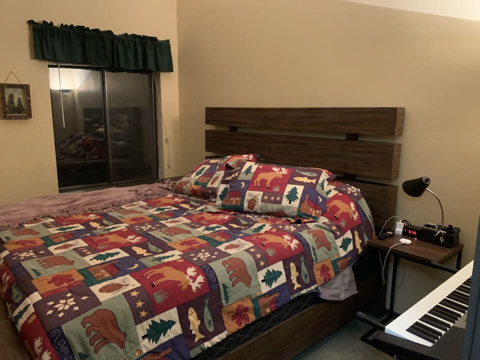 Master bedroom with king bed and streaming smart TV