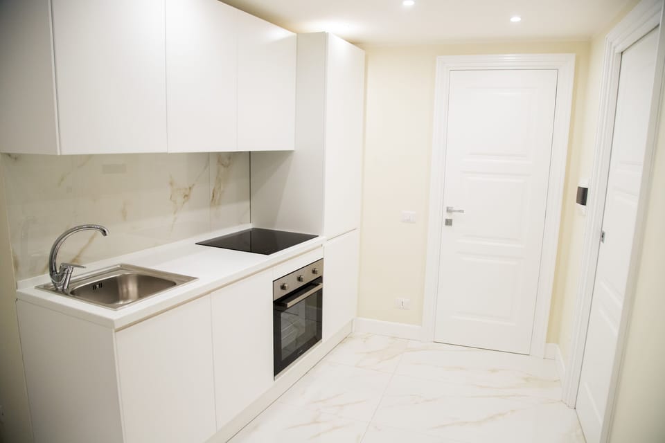 Deluxe Condo | Private kitchen | Coffee/tea maker