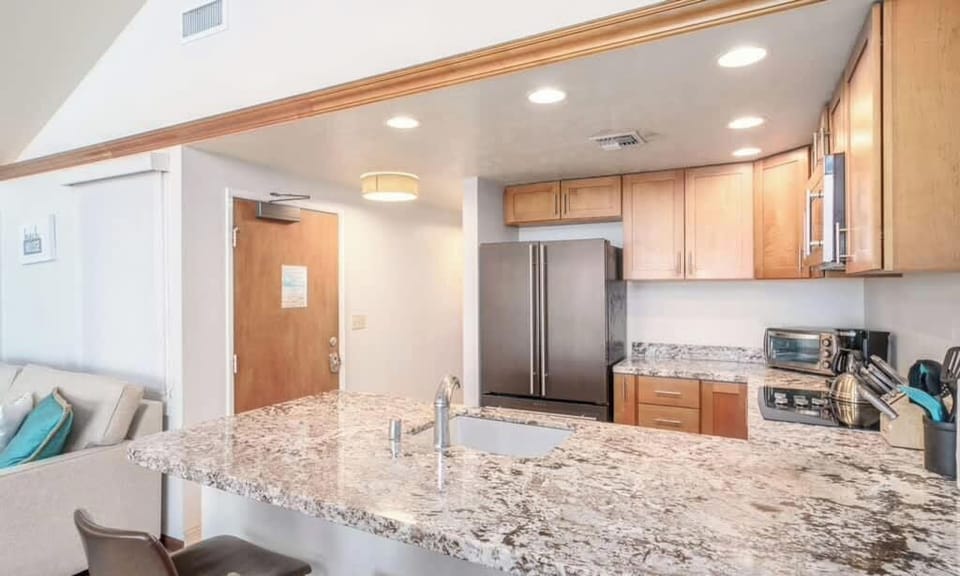 Enjoy seamless mornings in our well-appointed kitchen with a handy breakfast bar. Ideal for quick bites before exploring!
