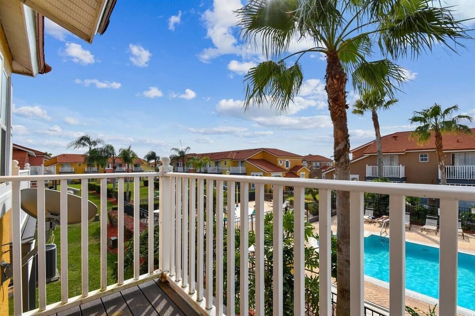 Step onto your private balcony and enjoy vibrant views of swaying palm trees against a bright blue sky. The sparkling pool below invites you for a refreshing dip or a relaxing afternoon soaking up the sun.