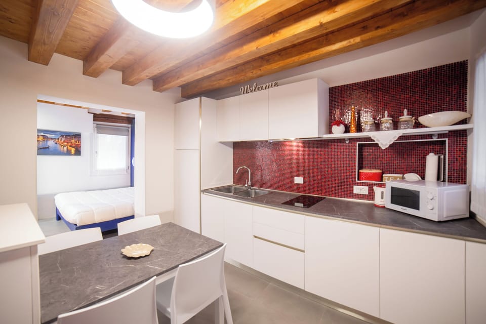 Apartment | Private kitchen | Full-size fridge, microwave, stovetop, espresso maker