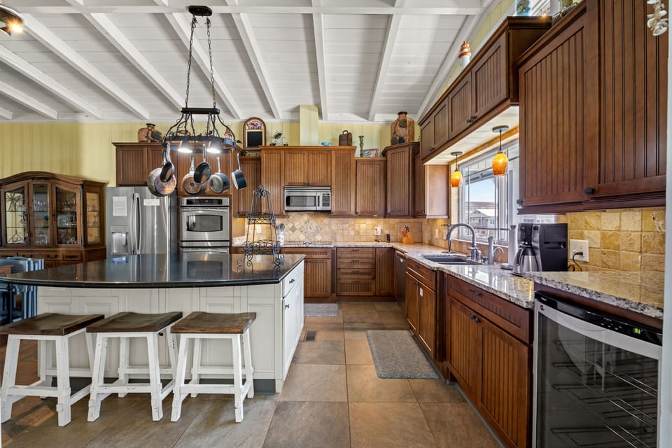 The kitchen island provides additional counter space for serving snacks or meals