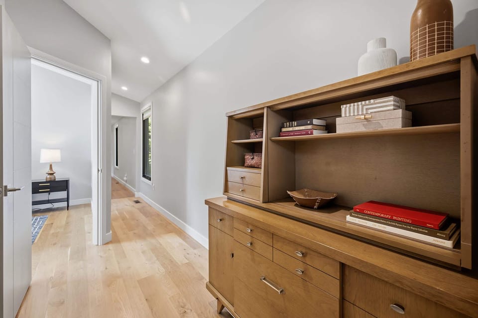 Hallway storage keeps everyday essentials within easy reach.