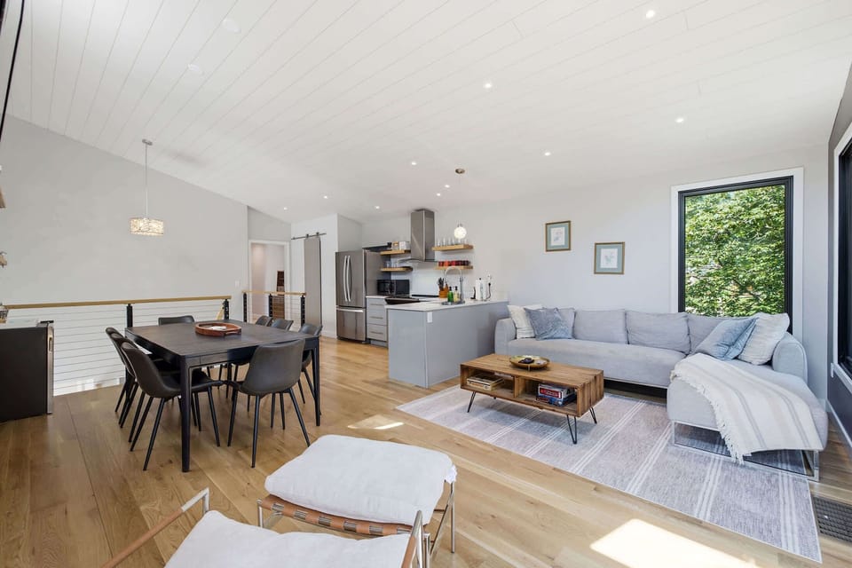 Open concept kitchen, dining, and living area keeps everyone connected.