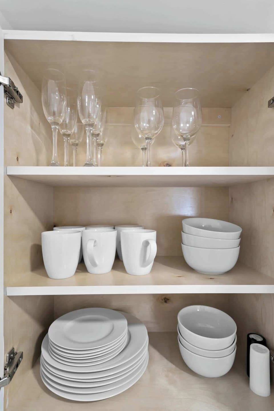 Everything in its place—this well-stocked kitchen makes dining in easy with clean dishware and thoughtful touches. Perfect for extended stays.