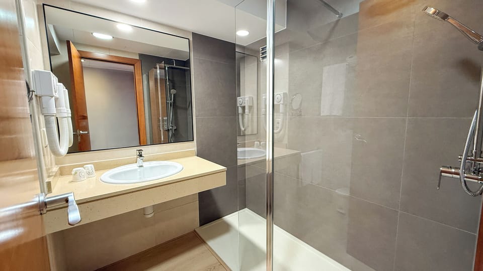 Shower, free toiletries, hair dryer, towels