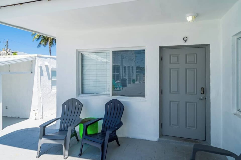 Private entrance with shaded patio and comfy chairs—perfect for relaxing after a day in the sun.