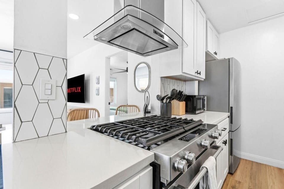Cook meals easily with sleek countertops, modern cabinetry, and all the essentials.