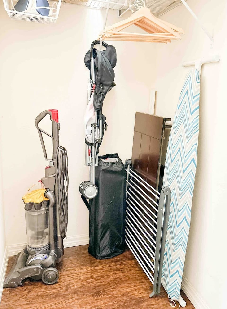 The first-floor master suite bathroom includes a portable crib, ironing board, clothesline, iron, and a baby stroller for your convenience.
