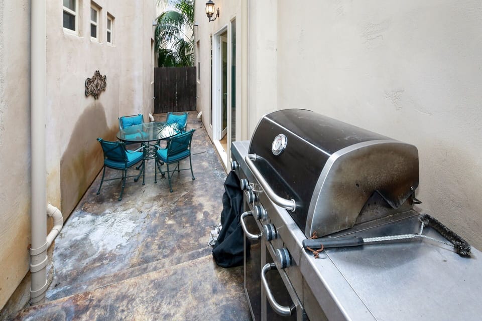 Side patio with BBQ and dining table