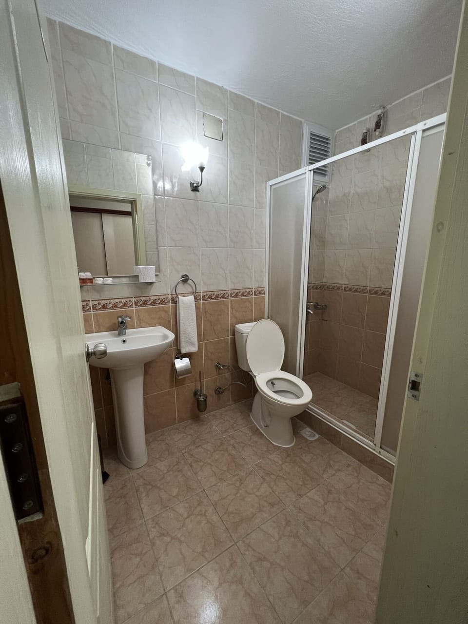 Standard Room, Multiple Beds, Smoking, City View | Bathroom | Shower, rainfall showerhead, hair dryer, towels