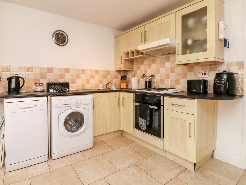 Fridge, electric kettle, toaster, cookware/dishes/utensils