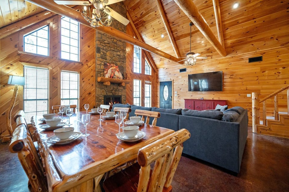Large open concept living and dining with a view of the loft