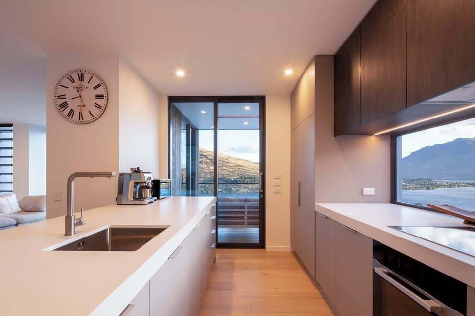 This spacious kitchen boasts top-of-the-line appliances, a large island for meal prep, and plenty of storage, creating the perfect space for culinary creativity.