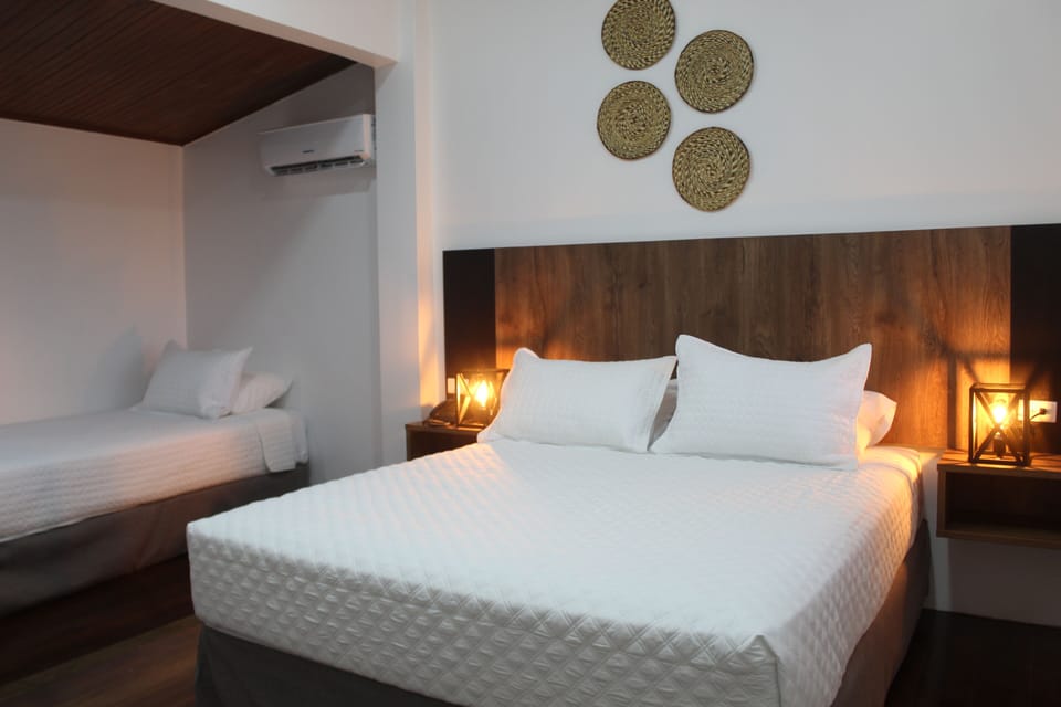Family Triple Room, Ground Floor | Frette Italian sheets, premium bedding, down comforters