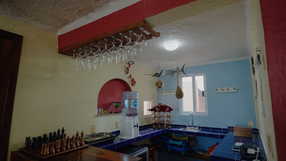 Full wet bar and drink fridge attached to main living area and kitchen.