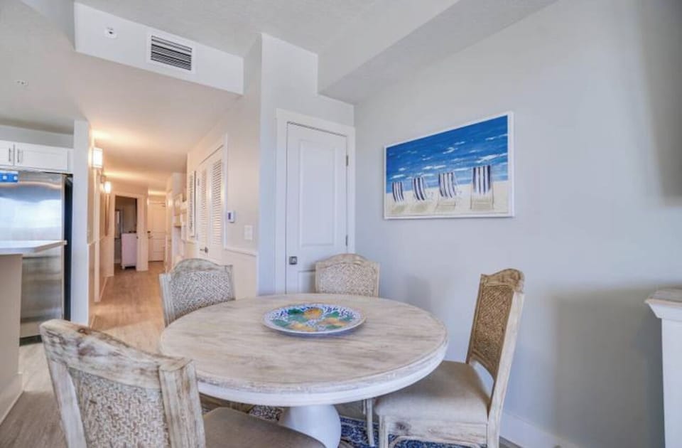 Spacious table and four padded chairs are waiting for your family!