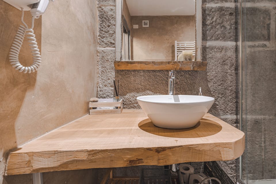 Superior Room | Bathroom | Shower, hair dryer, towels, soap