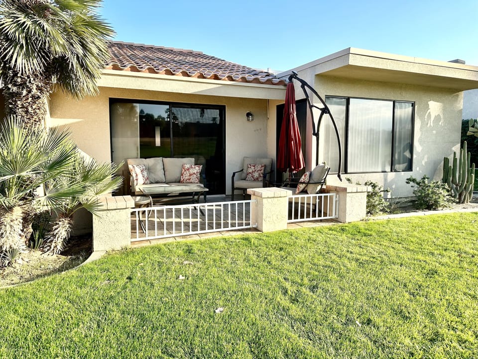 Rear patio, green belt, view of the 5th green