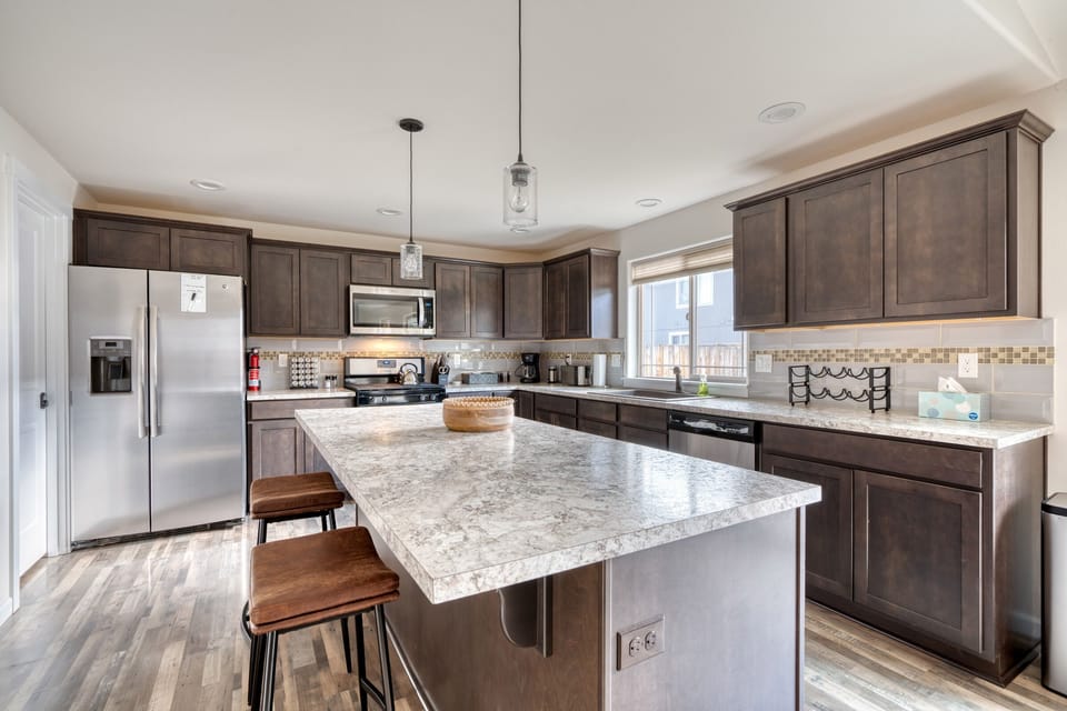 Large center island with counter seating.
