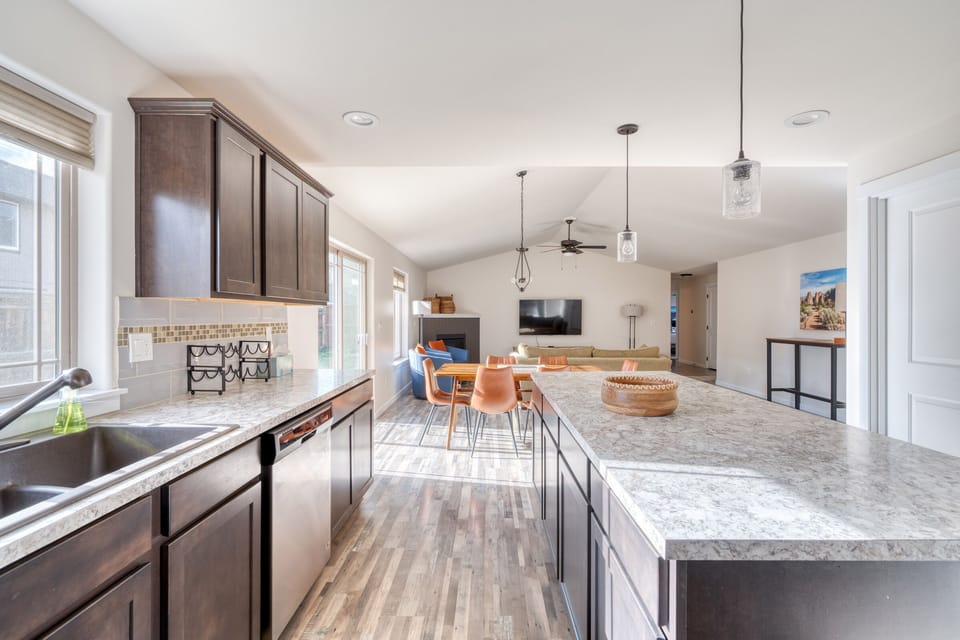 Modern appliances include microwave, stove, oven, refrigerator and dishwasher.