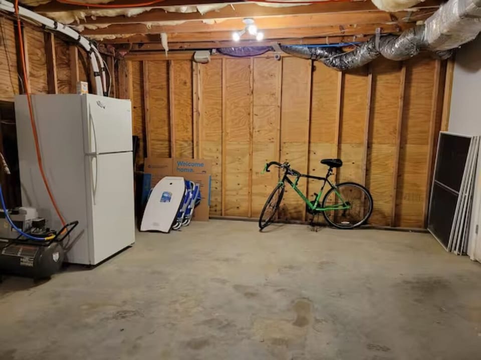 fridge and extra beach gear. fishing gear is on the other side of the basement 