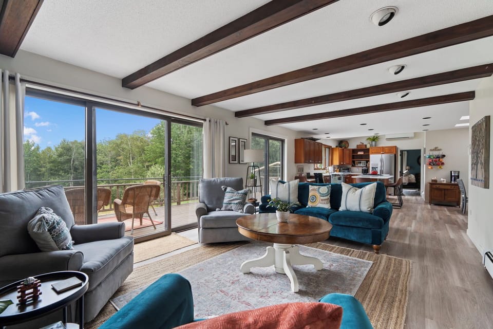 Living room has access to the large deck. 