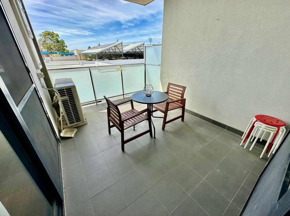 Relax and unwind on this private balcony, perfect for enjoying your morning coffee or soaking up the city views.