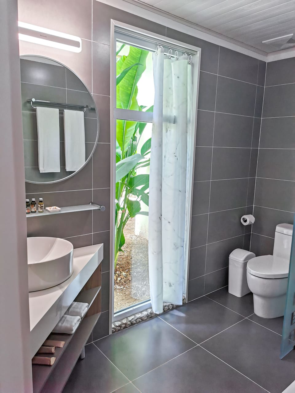 Shower, rainfall showerhead, designer toiletries, hair dryer