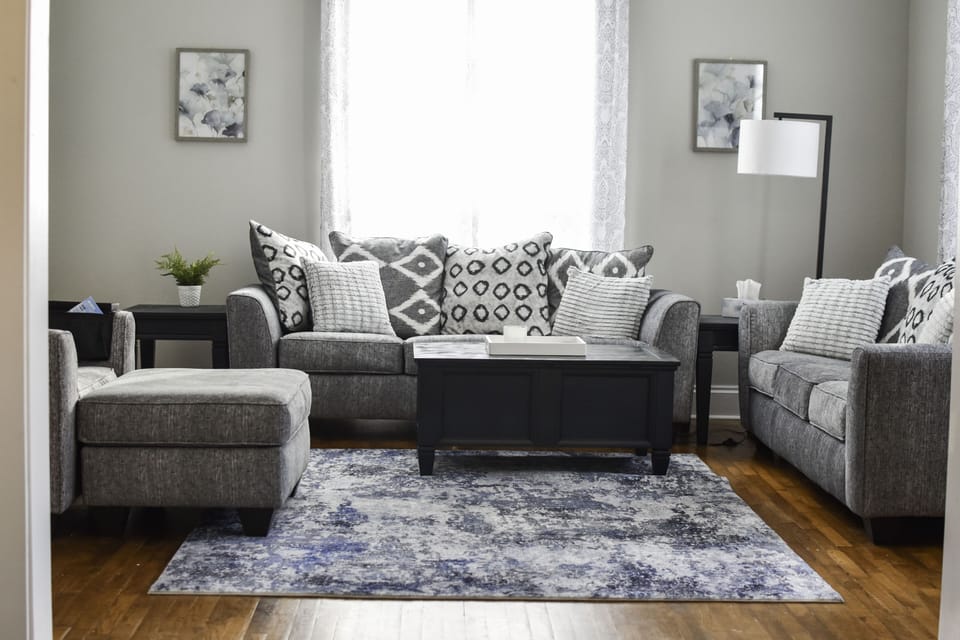 Living room with two couches and an oversized chair perfect for a comfy day in!