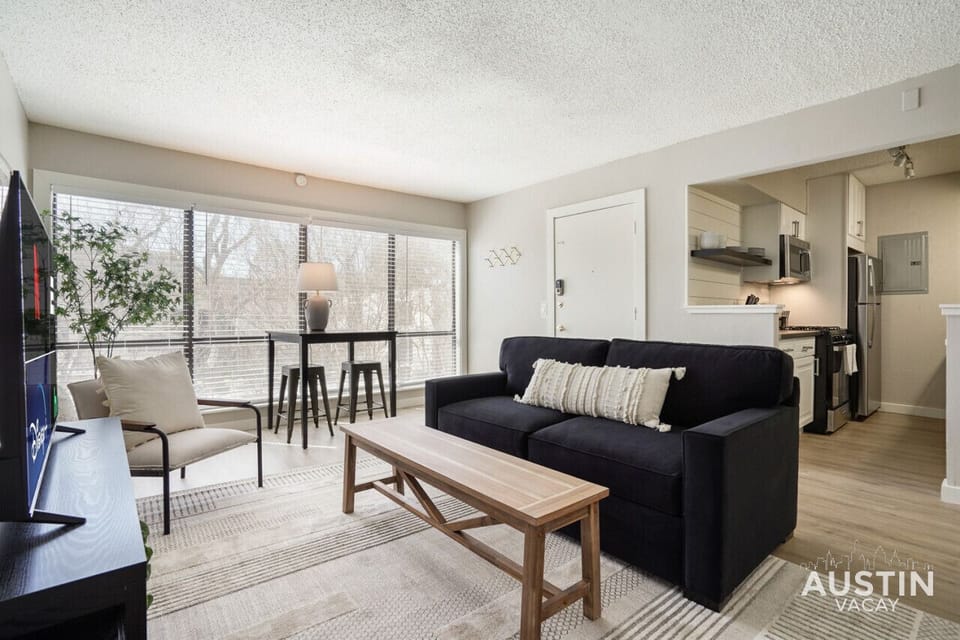 Living room with sleeper sofa and view of the pool