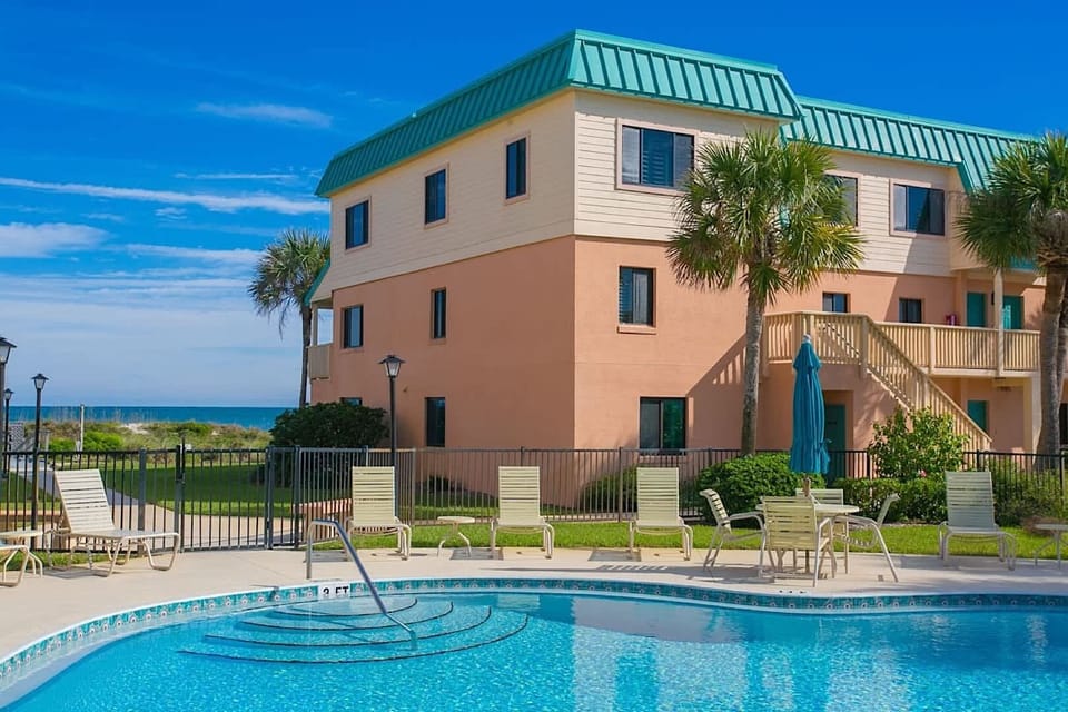 - Poolside charm surrounded by green lawns and tropical palms  
- Lounge in the sun or enjoy a shaded spot with cool drinks  
- A peaceful retreat for mornings or fun afternoons with friends  
